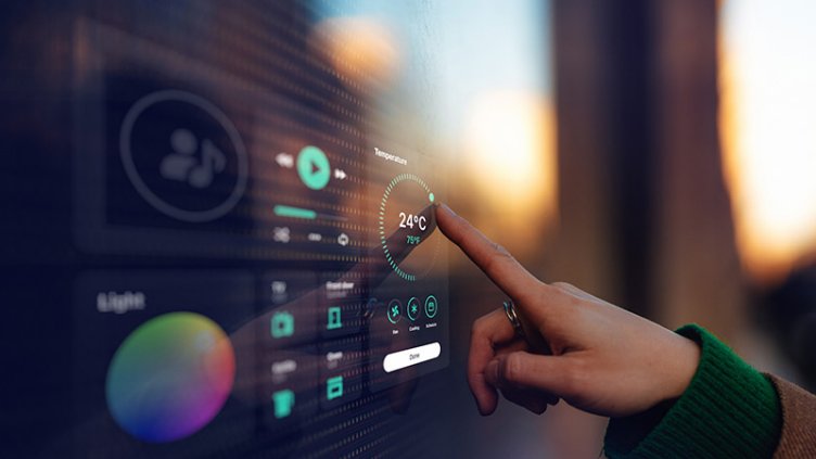 Person controlling temperature of building on touch screen panel