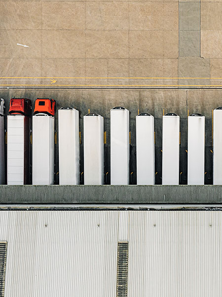 Aerial view of warehouse and trucks