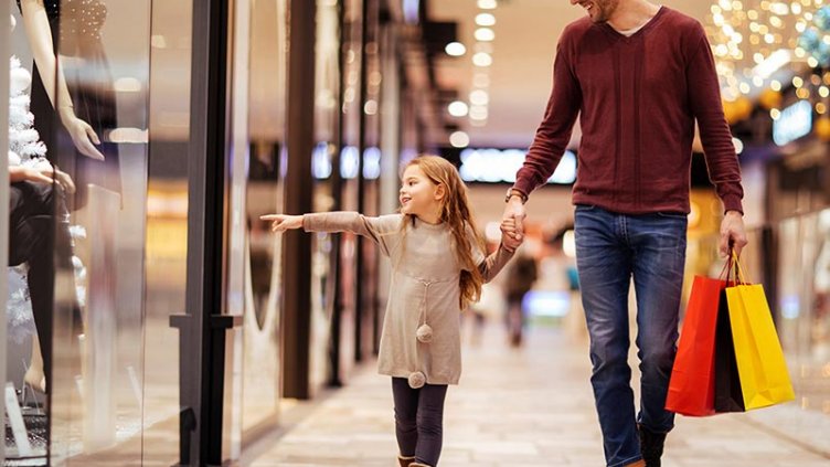 Canadians doing holiday shopping in a mall