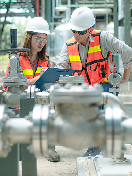 2 people working on machinery