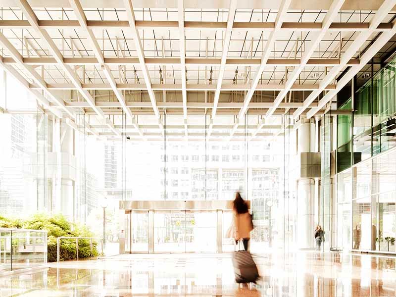 Woman with suitcase in lobby