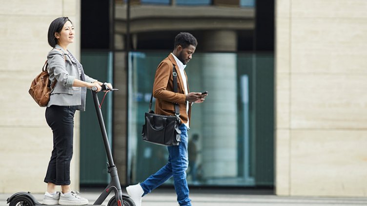 People walking past an office building