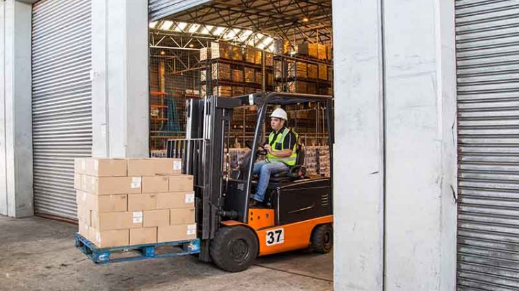 Man driving a forklift