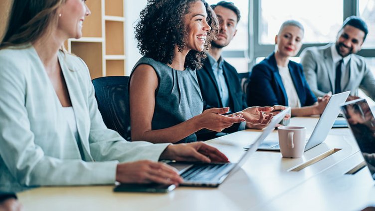 People smiling in a meeting