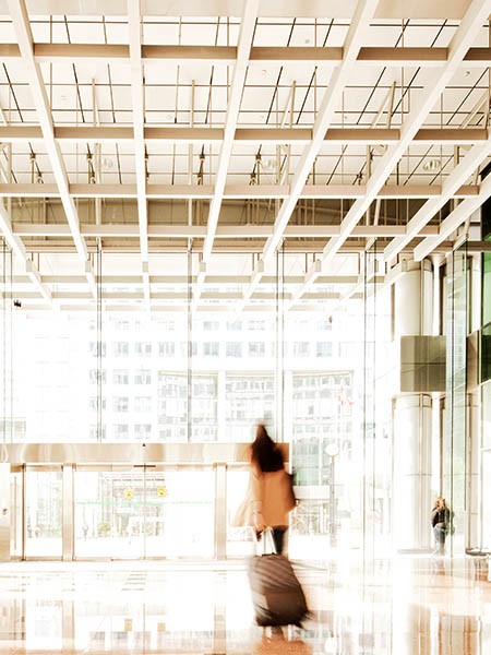 Woman with suitcase in lobby