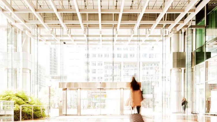 Woman with suitcase in lobby