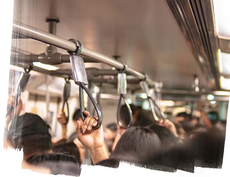 View of people holding straphangers in the metro