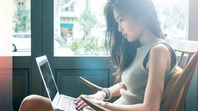View of a lady working in JLL office passionately