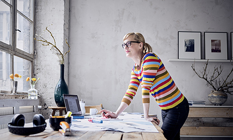 A woman standing and thinking