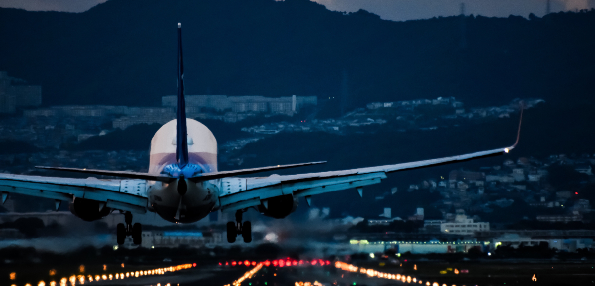 backview of plane taking off