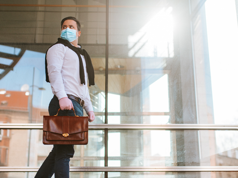 businessman in a mask going to work