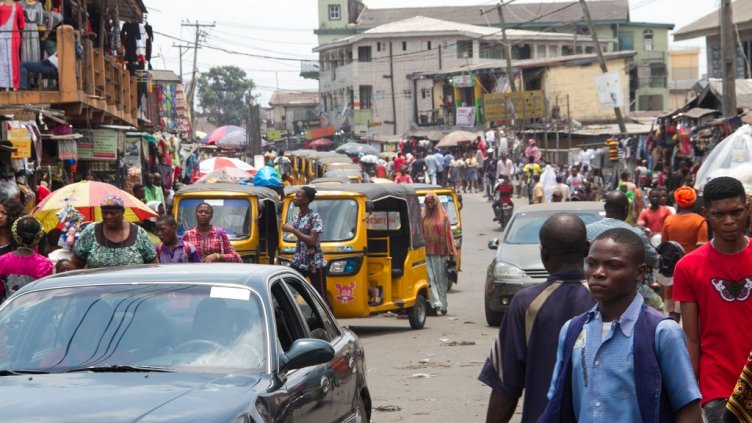 Ajegunle City, Lagos State Nigeria March 22, 2018: Busy Streets bustling with commercial activity; Shutterstock ID 1054621472; Departmental Cost Code : 162800; Project Code: GBLMKT; PO Number: GBLMKT; Other: 