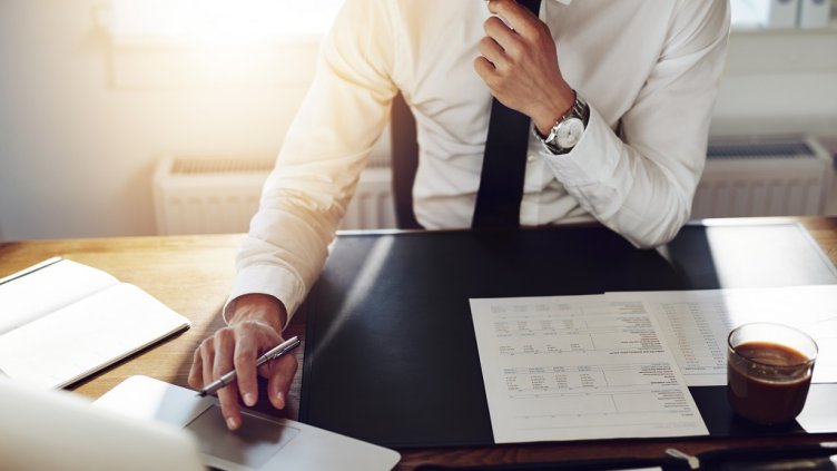 Business man working at office with laptop and documents on his desk, consultant lawyer concept