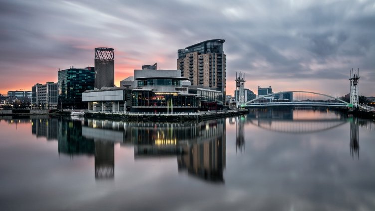 Long exposure at Salford Quays on a calm morning with beautiful sunrise and clear reflections.