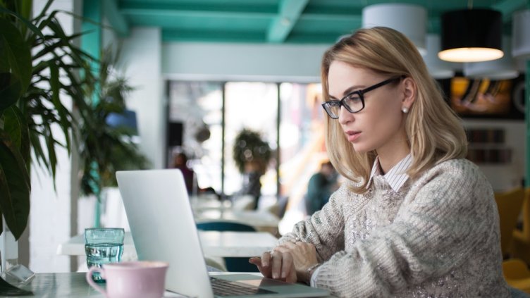 Busy female student preparing for exam in cafe; Shutterstock ID 595722560; Departmental Cost Code : 162800; Project Code: GBLMKT; PO Number: GBLMKT; Other: