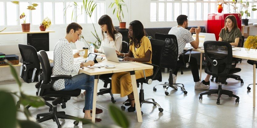 Employees working in the collaborative workspace