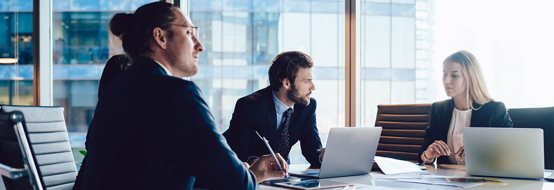 Employees discussing at meeting room