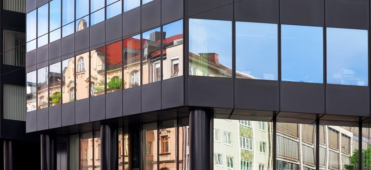 Old building architecture reflected in modern building. Front view of the building. Munich, Germany.; Shutterstock ID 243425332; Departmental Cost Code: 164400