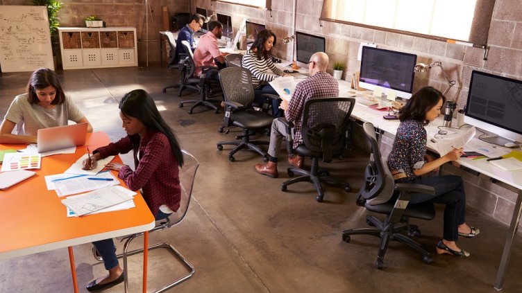 Elevated View Of People Working In Modern Design Office