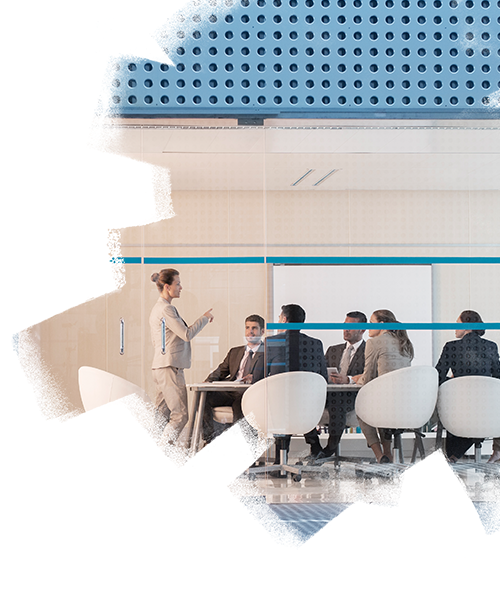 Employees having a meeting inside the meeting room in the real estate office