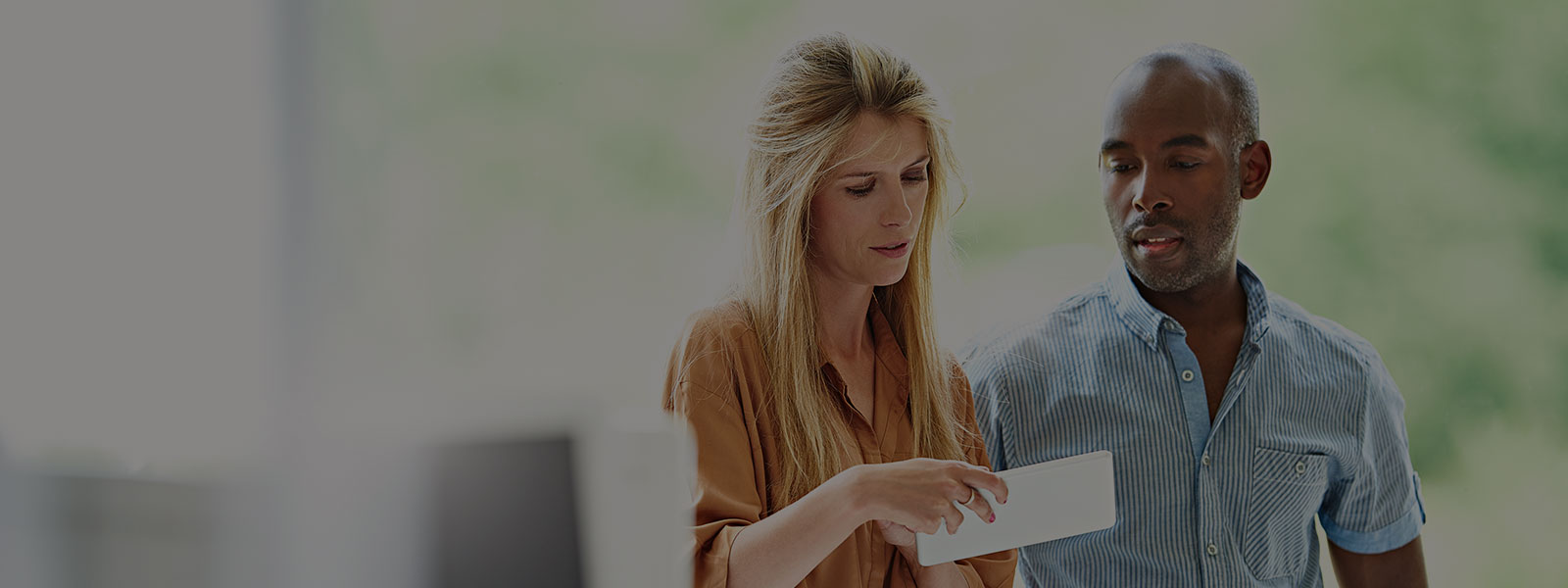 Men and Women reading an envelope