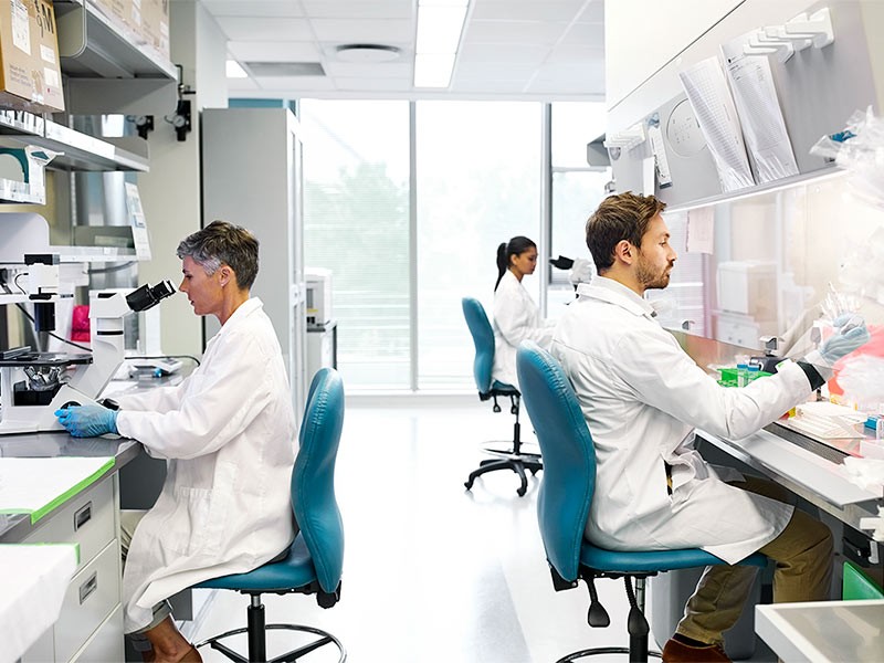Scientiests making testing in laboratory