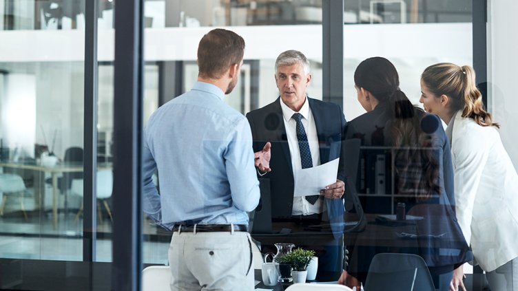 Picture of a team manager assigning important tasks to his team members