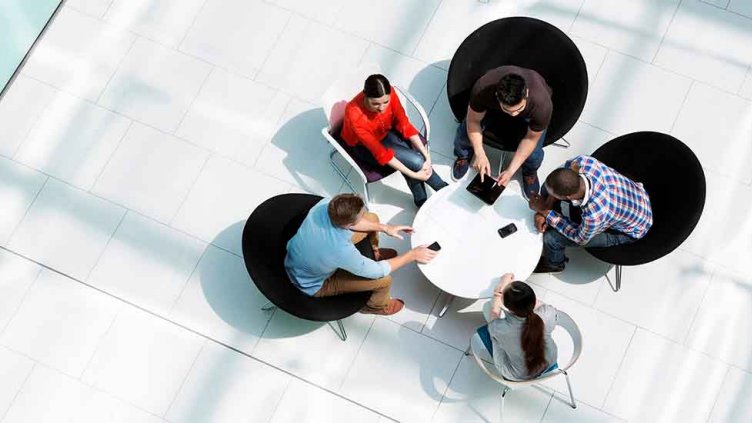 Group of professionals together and discussing