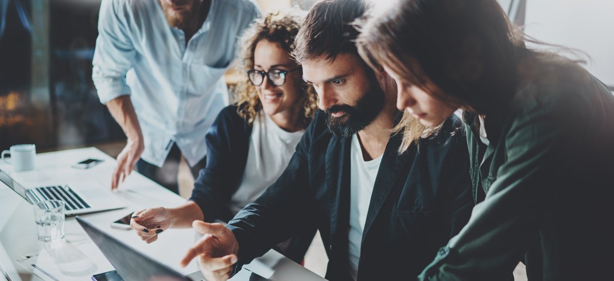 hipster millennials looking at computer