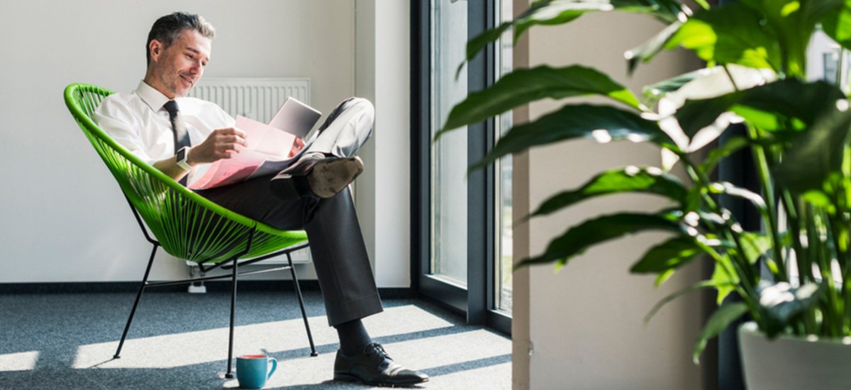 office worker sits in sustainable office