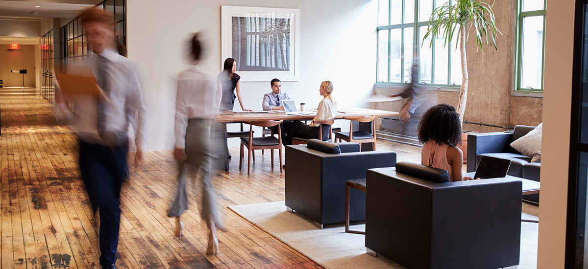 People working inside the real estate office building