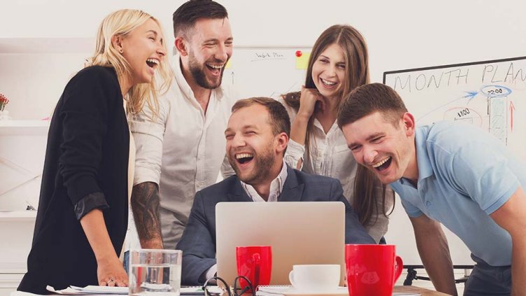 Team laughing during the meeting inside the meeting room