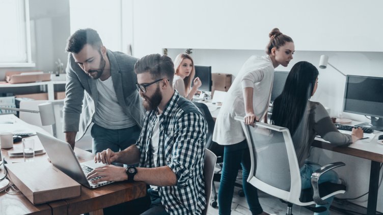 workers collaborating in tech office