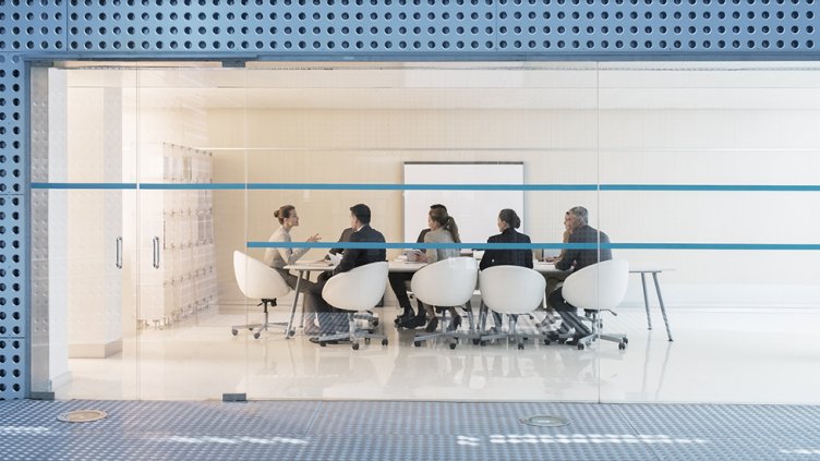 Employees doing work meetings in conference room