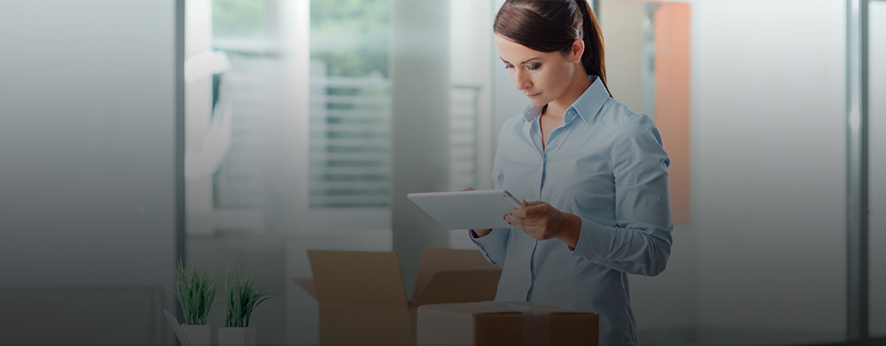 woman verifying shipments on laptop