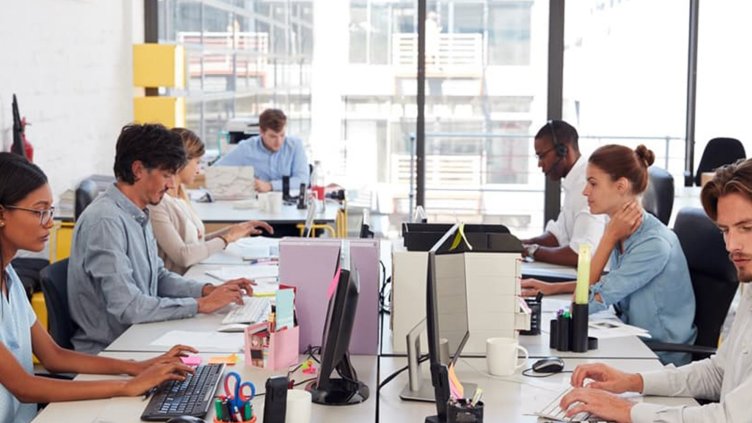 workers in an open plan work space