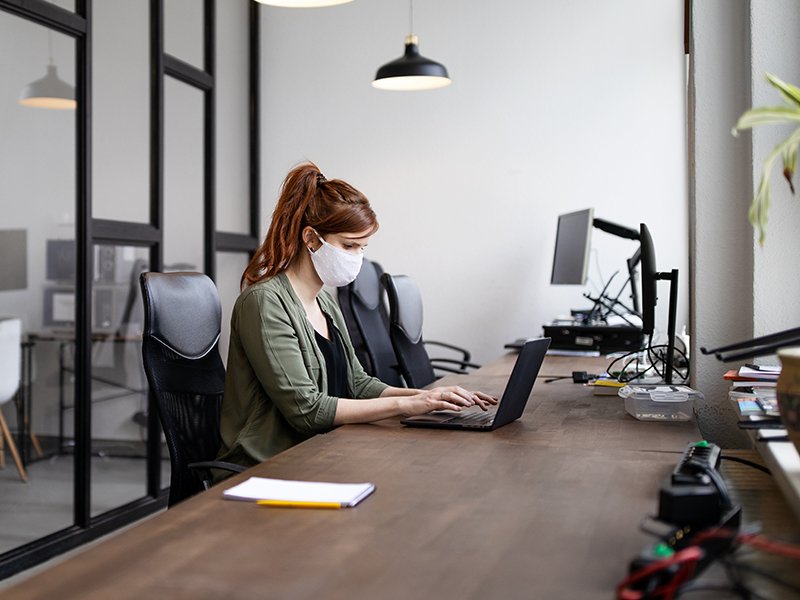 A lady working on laptop in Montreal office