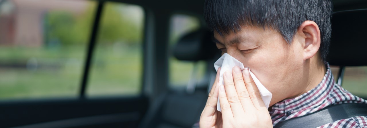 Man sneezing in the picture