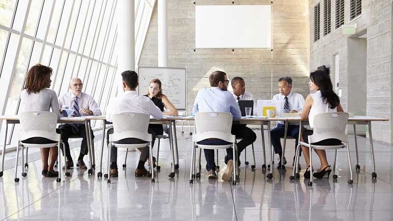 Group of architects having a meeting and discusssing their ideas together