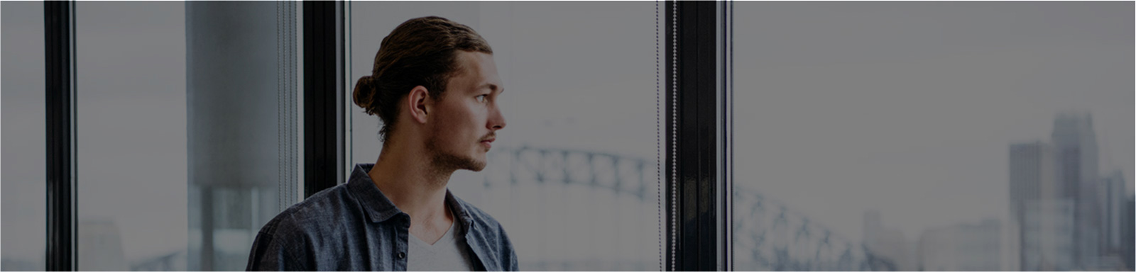 Man looking out of window